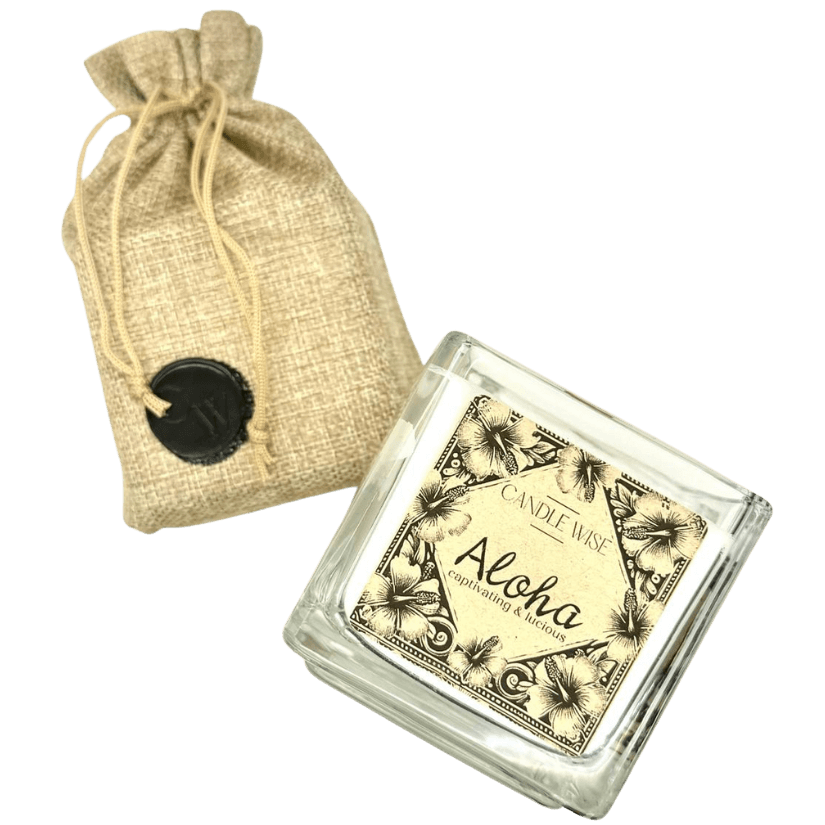 Aloha Large Scented Candle with a decorative burlap pouch, showcasing tropical design and lush fragrance.