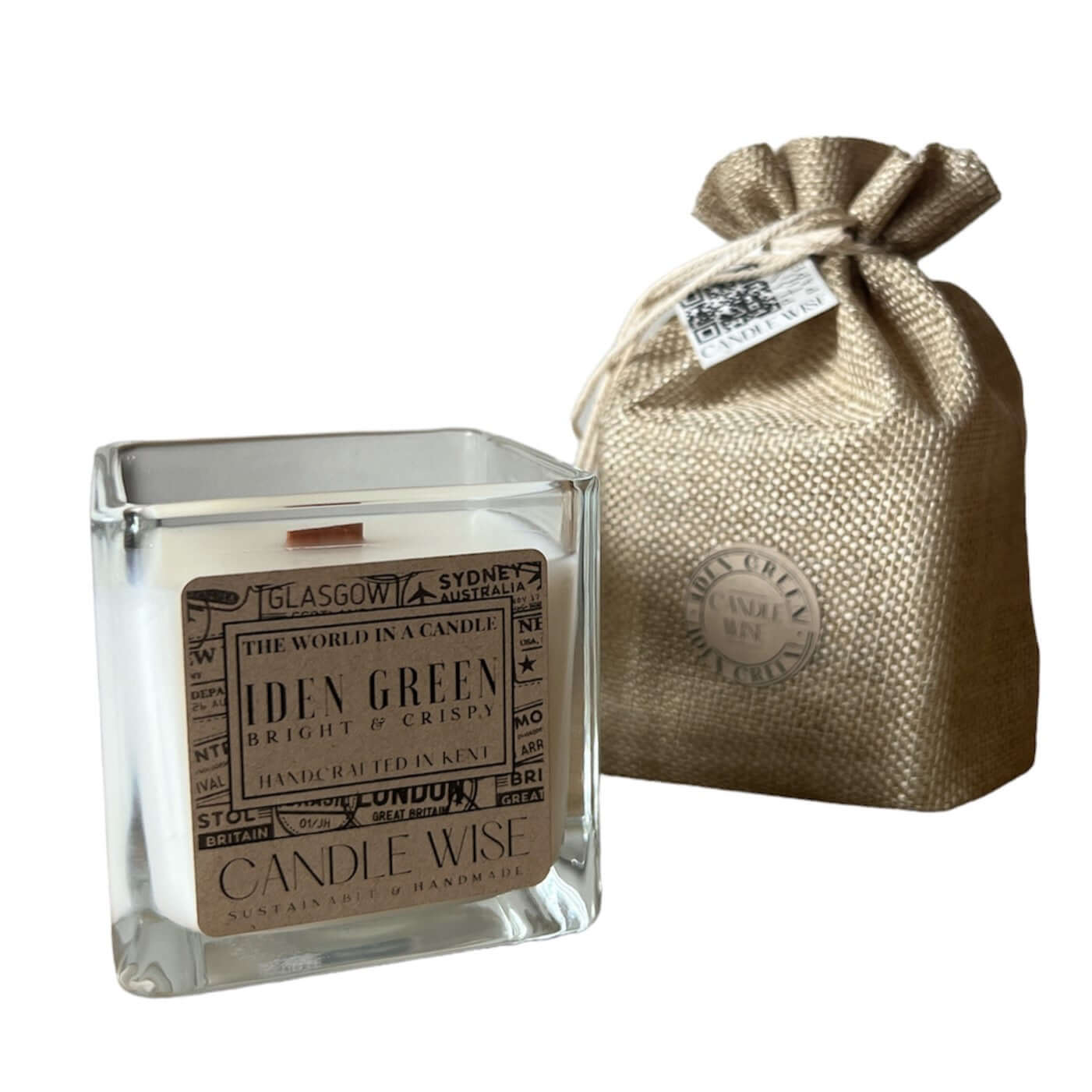 Iden Green Large Scented Candle in a glass jar with a beige pouch, exuding crisp apple fragrance.