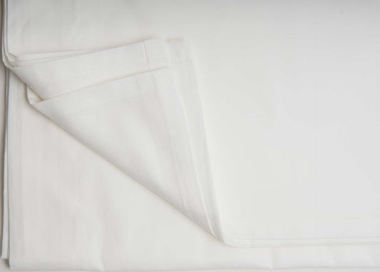 Luxury Flat Sheet - Organic Cotton in crisp white, showcasing percale weave and smooth texture for luxury bedding.