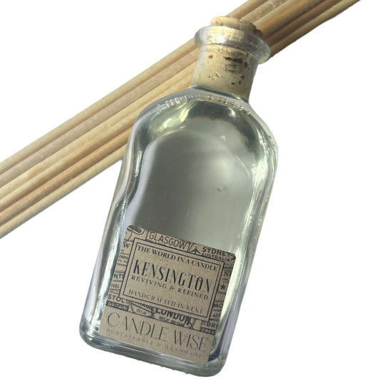 Kensington Long Lasting Reed Diffuser bottle with reeds, showcasing reviving and refined fragrance.