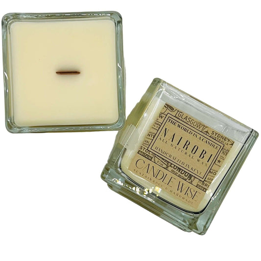 Nairobi scented candle in a square glass container, capturing the aroma of Kenyan coffee culture.