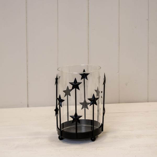 Medium Black Metal Star Candle Holder with Glass Insert showcasing a stylish design and decorative stars.