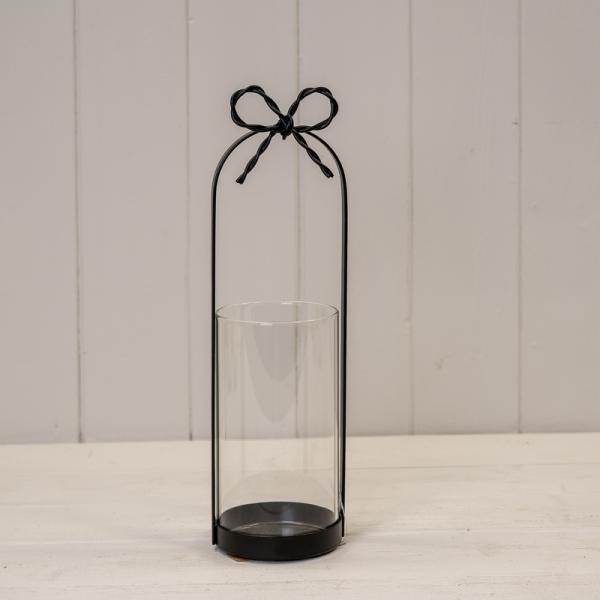 Small Black Metal Candle Holder with Bow featuring a delicate bow and cut-out design for elegant decor.
