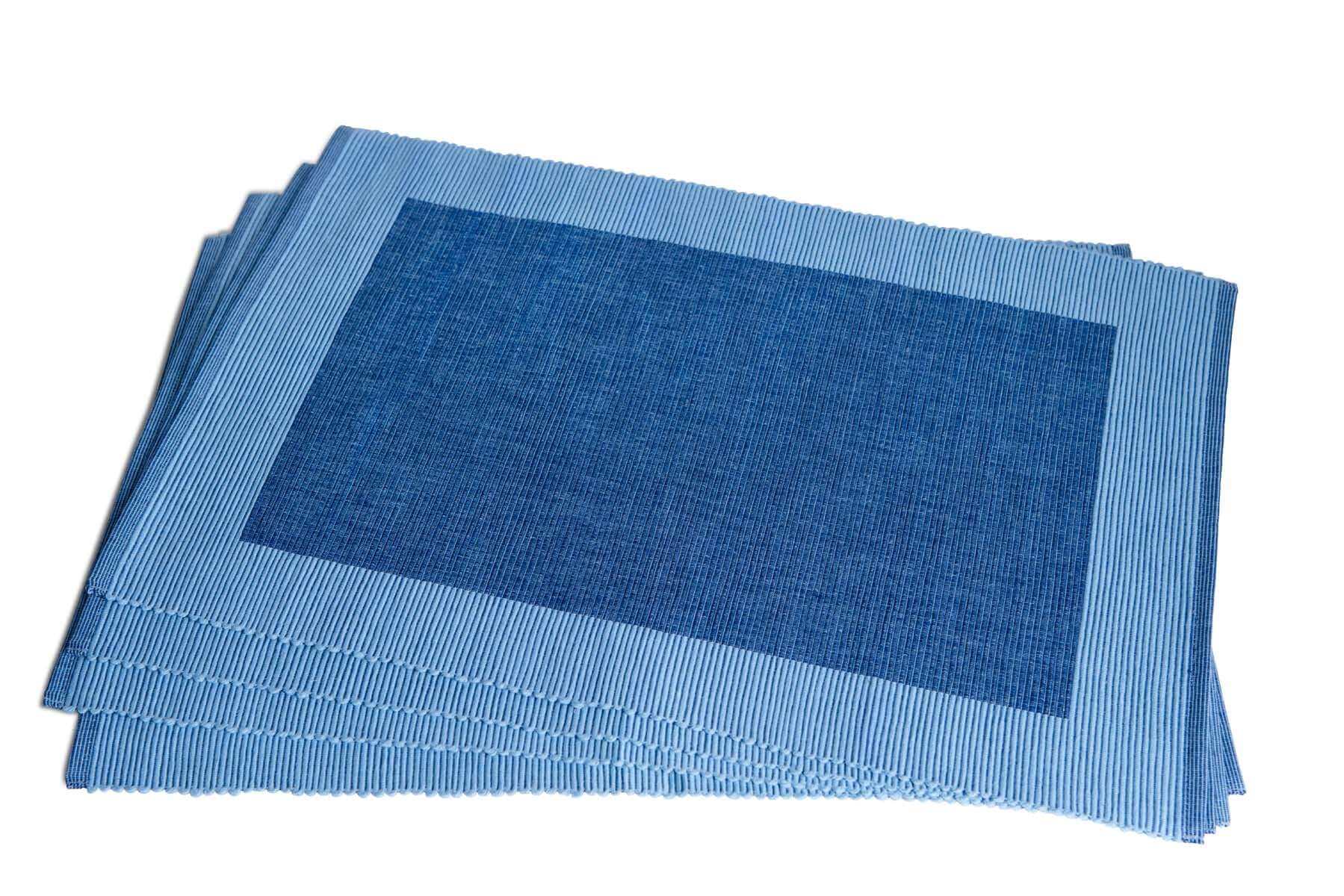 Luxury Placemats Blue - 4 Pack made from 100% organic cotton, showcasing elegant navy blue design on a dining table.