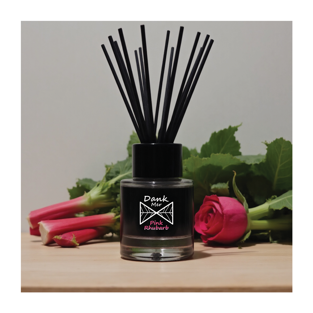 Pink Rhubarb Single Diffuser displayed with pink rhubarb and rose flowers, featuring sleek black design and fragrance sticks.