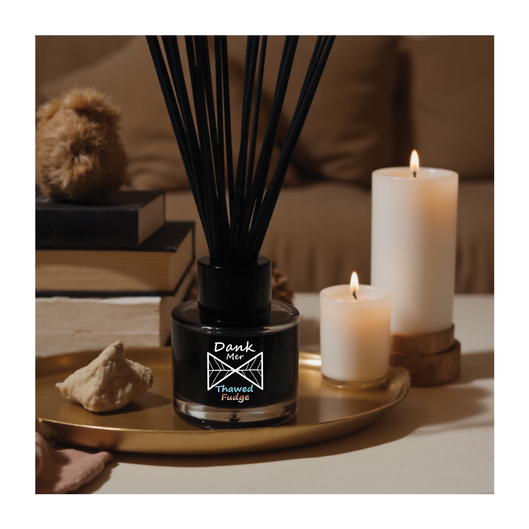 Thawed Fudge Single Diffuser displayed on a table with candles and books, offering a stylish scent solution.