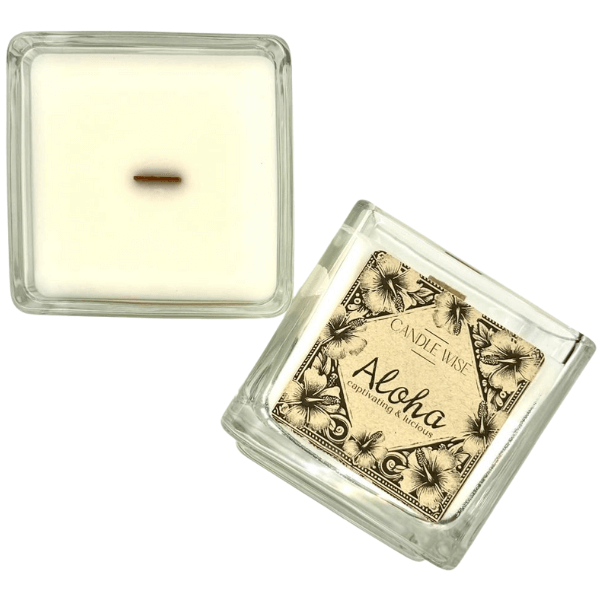 Aloha Large Scented Candle in a clear glass container with a decorative label, embodying tropical serenity.