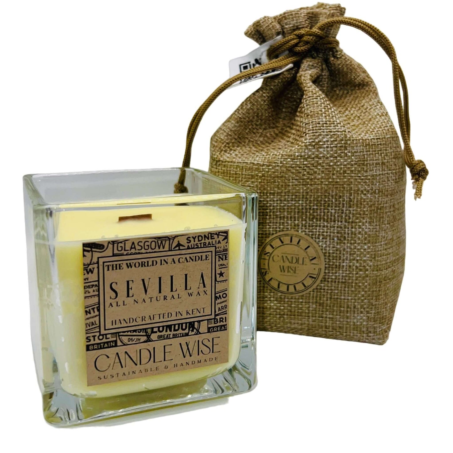 Sevilla Large Scented Candle packaged in a glass jar with a natural wax and burlap bag, offering a refreshing citrus aroma.