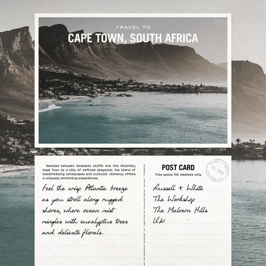 Postcard image featuring Cape Town, South Africa, with ocean views and cliffs, evoking a feeling of the Cape Breeze.