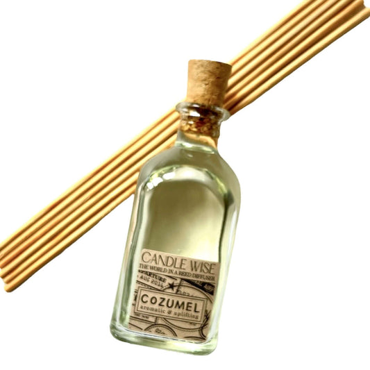 Cozumel Long Lasting Reed Diffuser bottle with rattan reeds, aromatic and uplifting scent for a vibrant home fragrance.