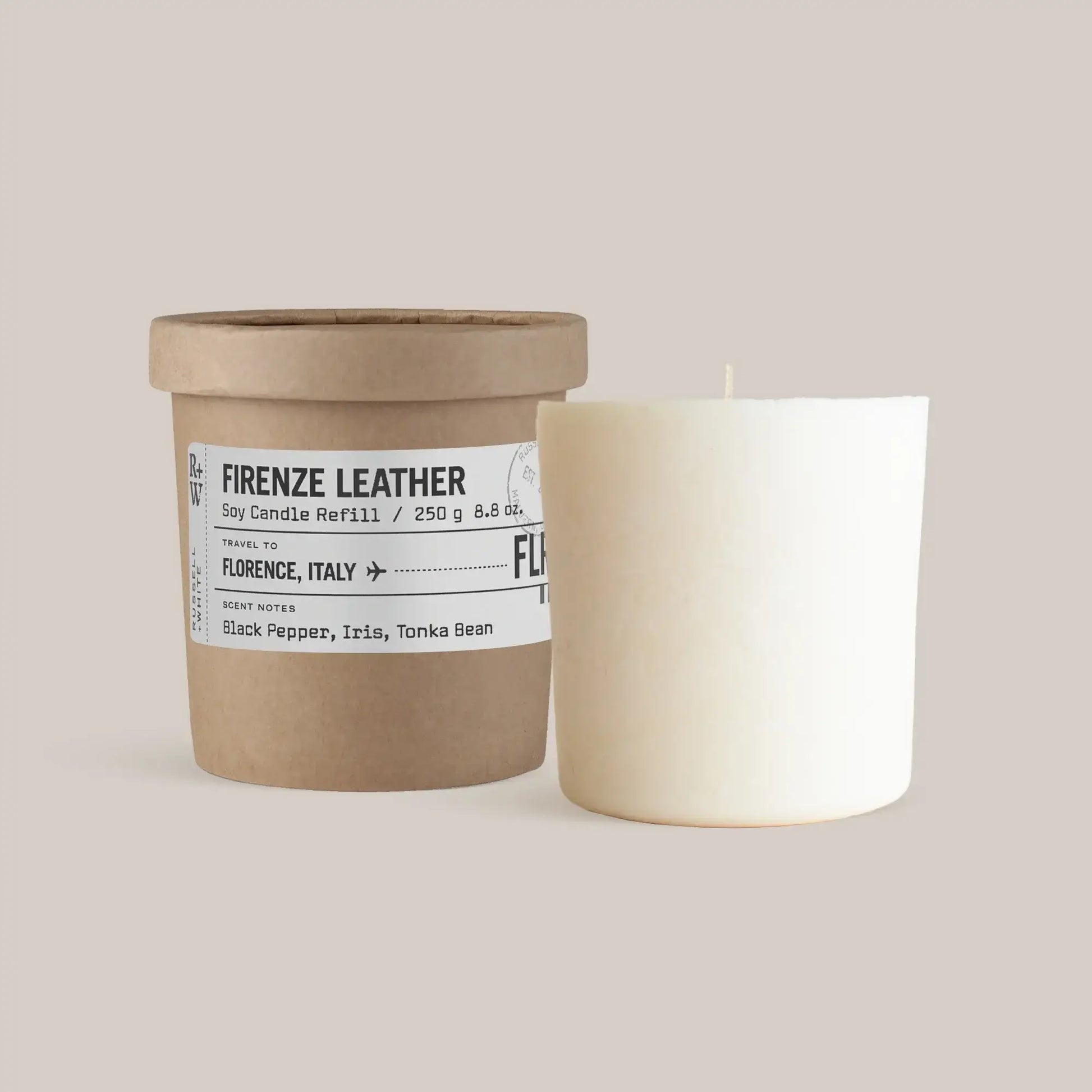 Firenze Leather Scented Candle Refill in a brown container with a white candle, featuring notes of black pepper and iris.