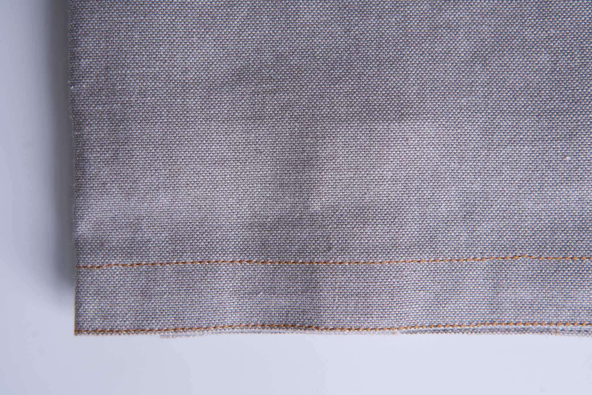 Close-up of Kitchen Towel Grey - Pack of 2 - Organic Cotton with chambray weave and fine stitching.