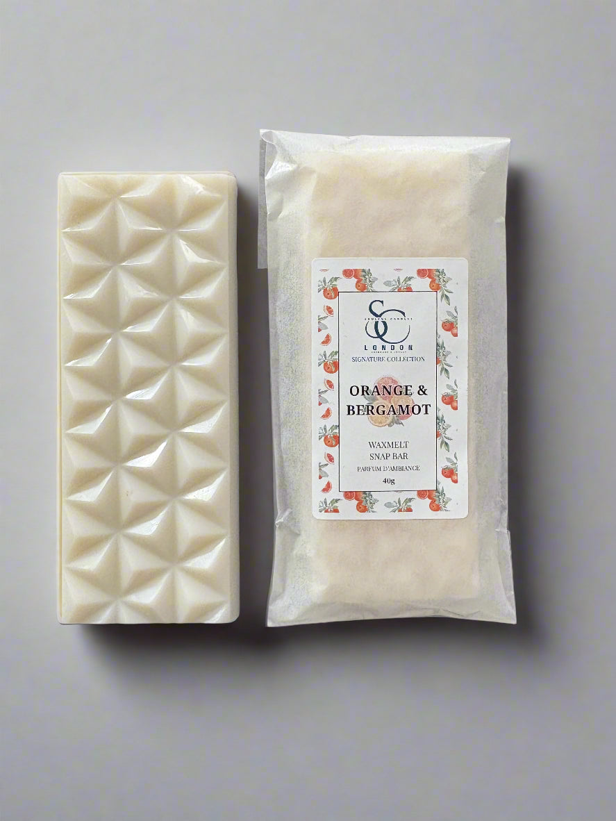 Orange & Bergamot Wax Melt Snap Bar 40g Luxury Soy Blend with floral packaging on a gray background.