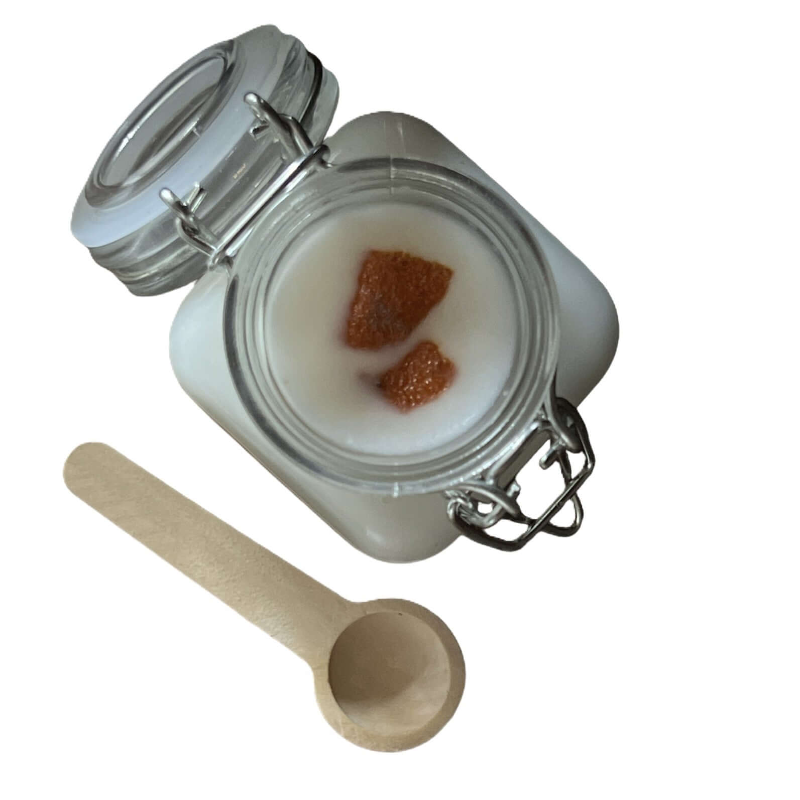 Iden Green Wax Melt in glass jar with wooden scoop, featuring fresh apple fragrance.