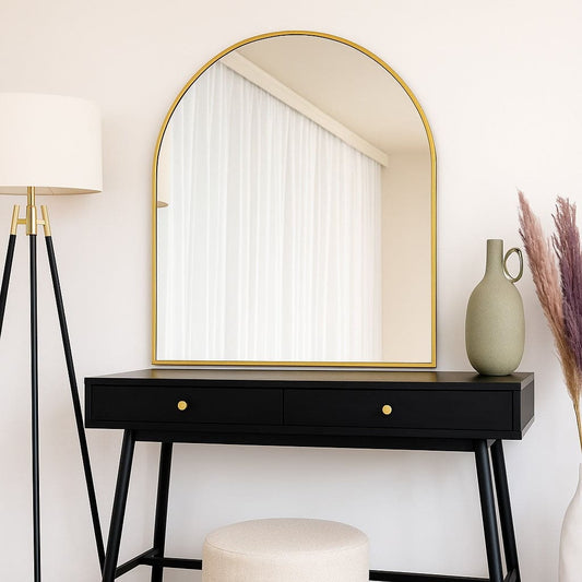 Akiko - Gold Metal Arched Mirror - 120cm x 95cm over a black console table with modern decor elements.