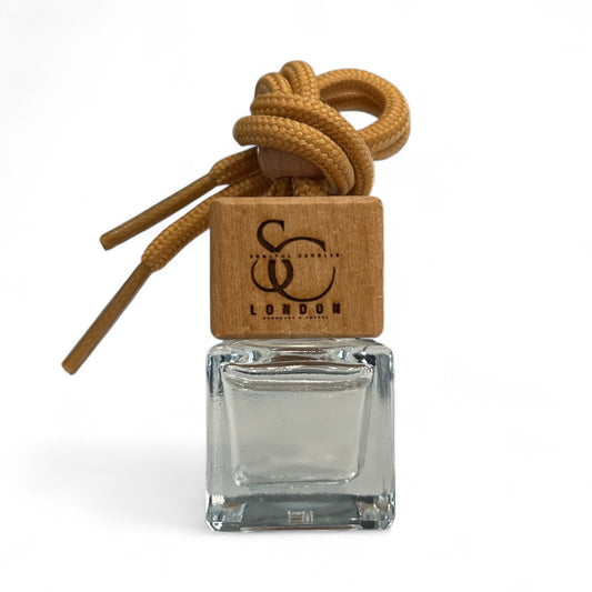 Wood Sage & Sea Salt Car Diffuser | Luxury Vegan Car Air Freshener in a glass container with wooden cap and rope.