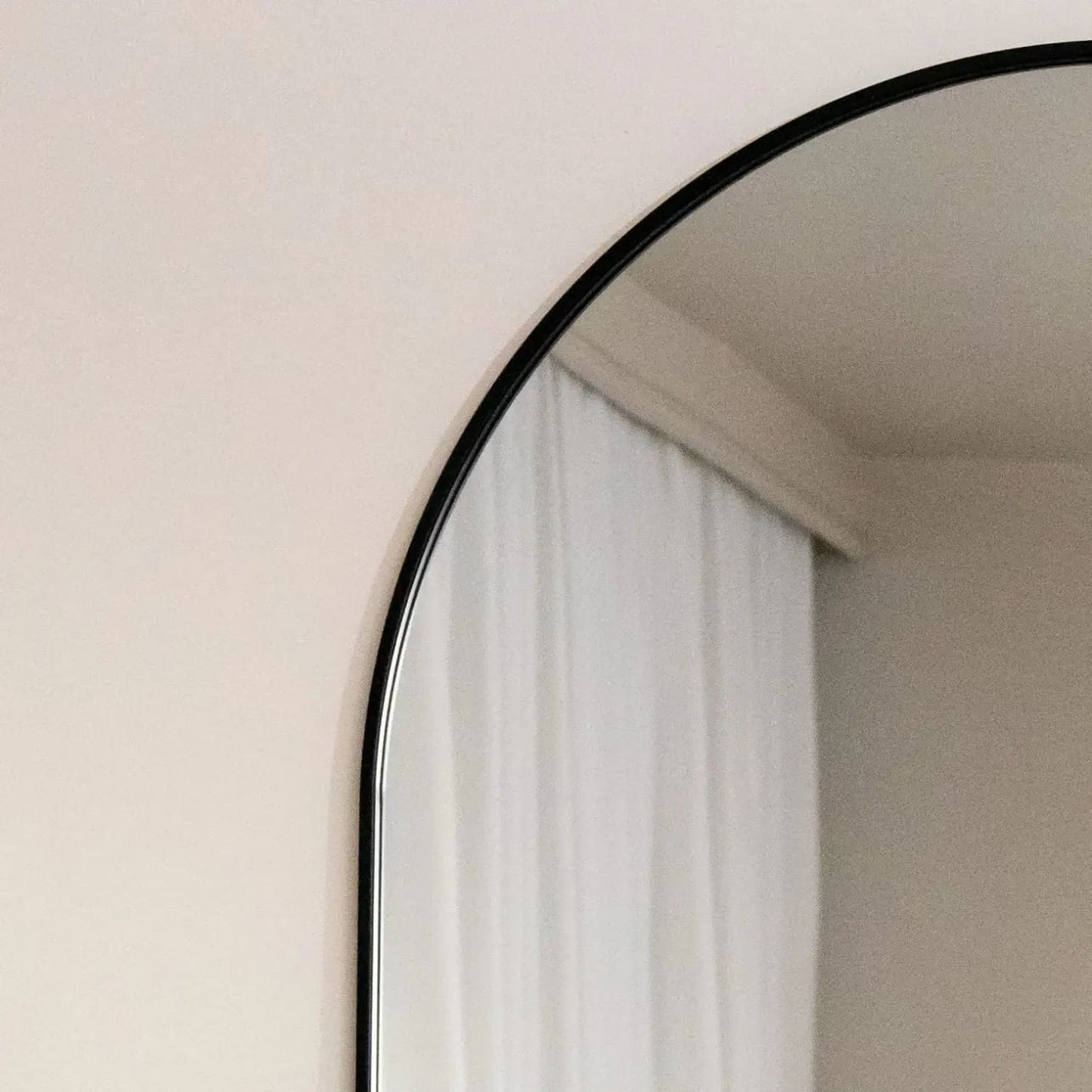 Emi - Full Length Black Metal Runway Oval Mirror - 180cm x 80cm close-up of the mirror's edge and reflection.
