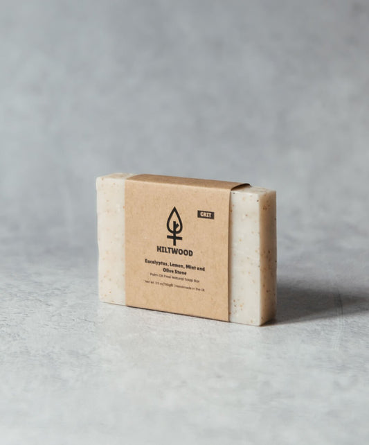 Eucalyptus Lemon Mint and Olive Stone Natural Soap Bar on a grey background with a natural label.