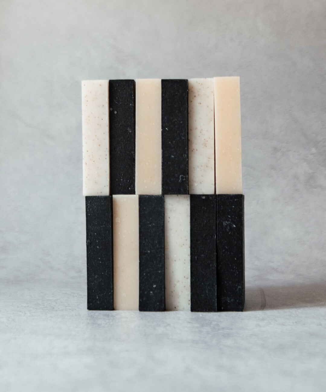 Natural Soap Bar Bundle 12 pack, featuring handcrafted soap bars in a unique black and white design.