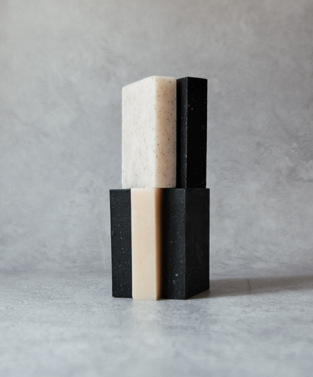 Natural Soap Bar Bundle 5 pack featuring handcrafted black and white soap bars stacked elegantly.