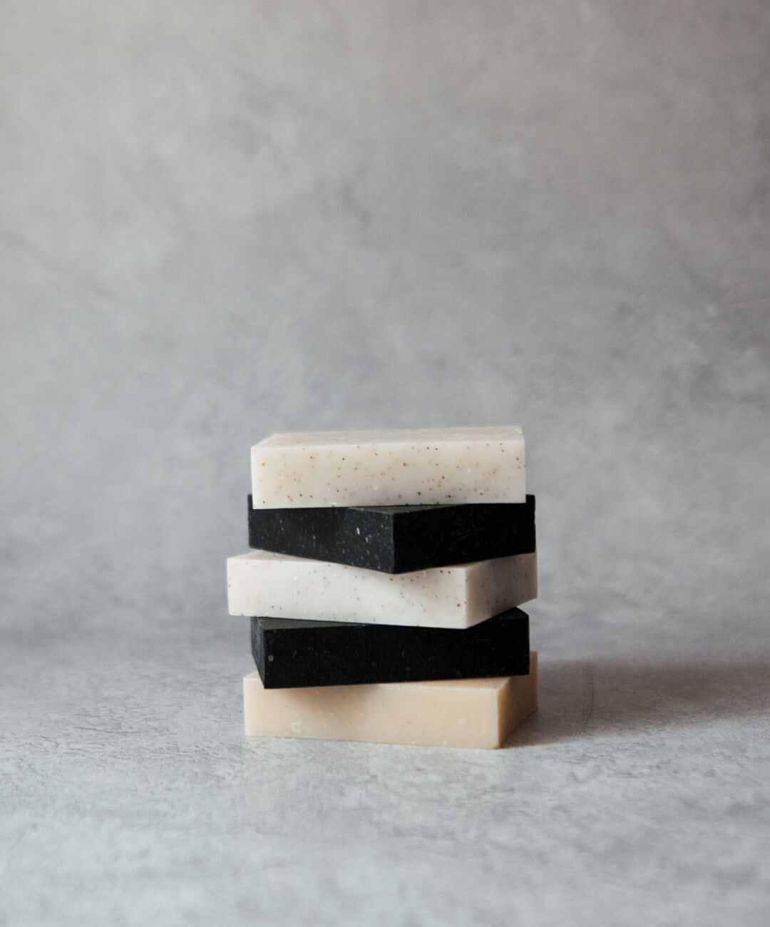 Natural Soap Bar Bundle 5 pack including handcrafted bars in various colors stacked.