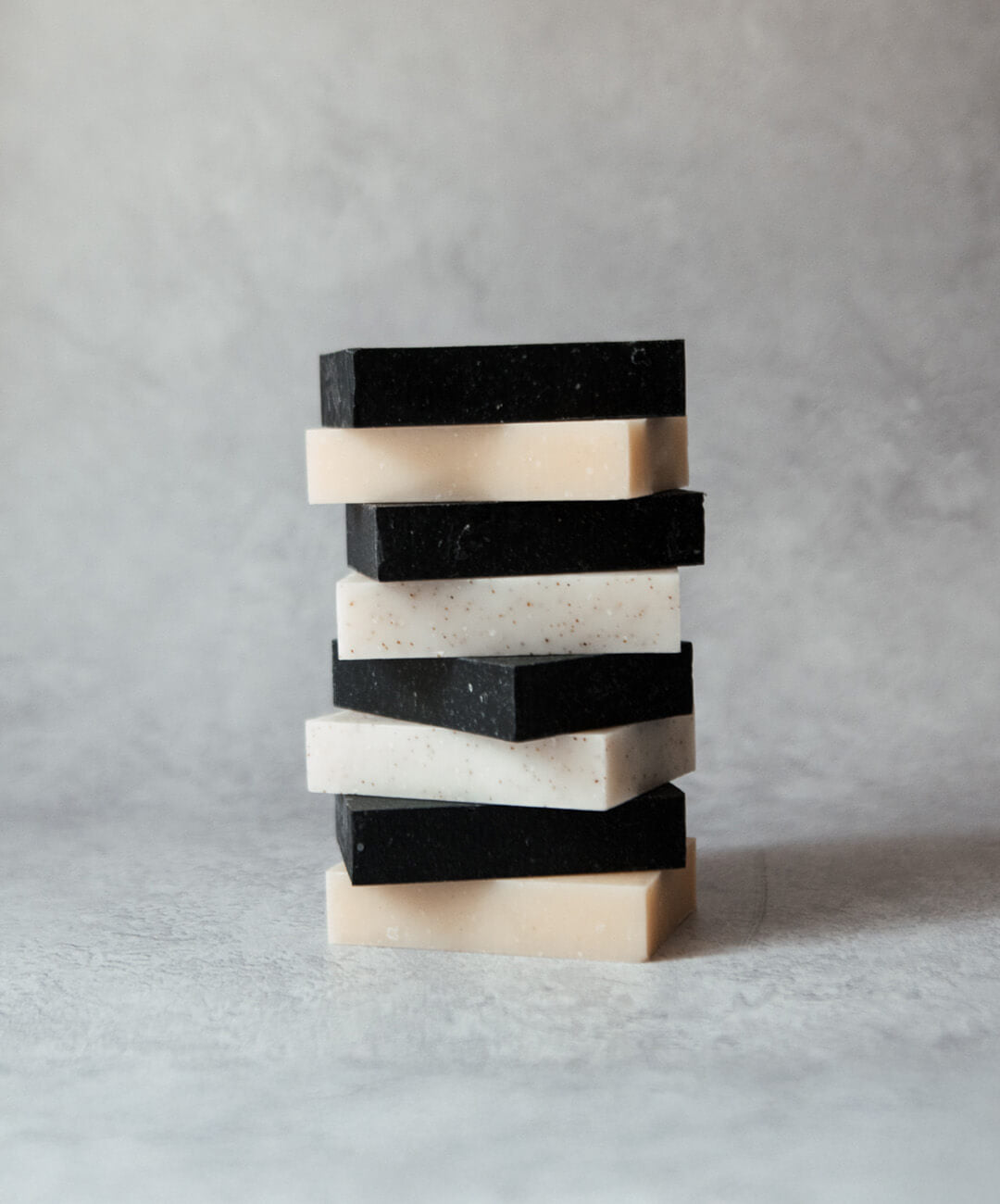 Natural Soap Bar Bundle 8 pack featuring stacked handcrafted soap bars in various colors.