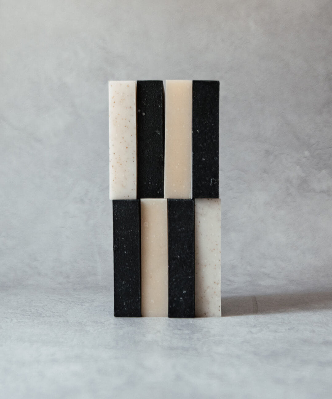 Natural Soap Bar Bundle 8 pack showcasing handcrafted soap bars in black and white colors.