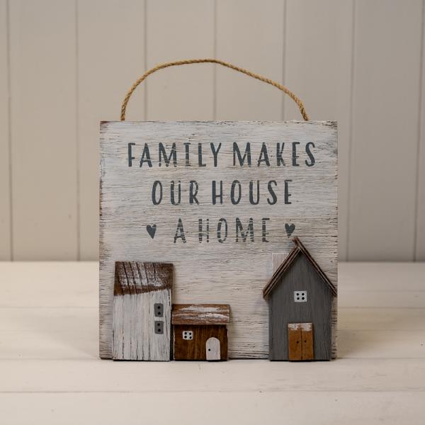 White Wooden Home Sign 'Family Makes Our House A Home' With Grey, White and Brown Stand Out Houses