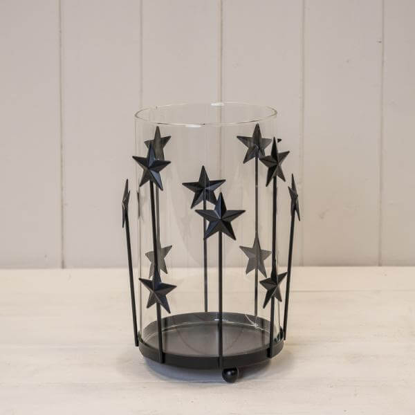 Large Black Metal Star Candle Holder with Glass Insert showcasing star design for elegant home decor.