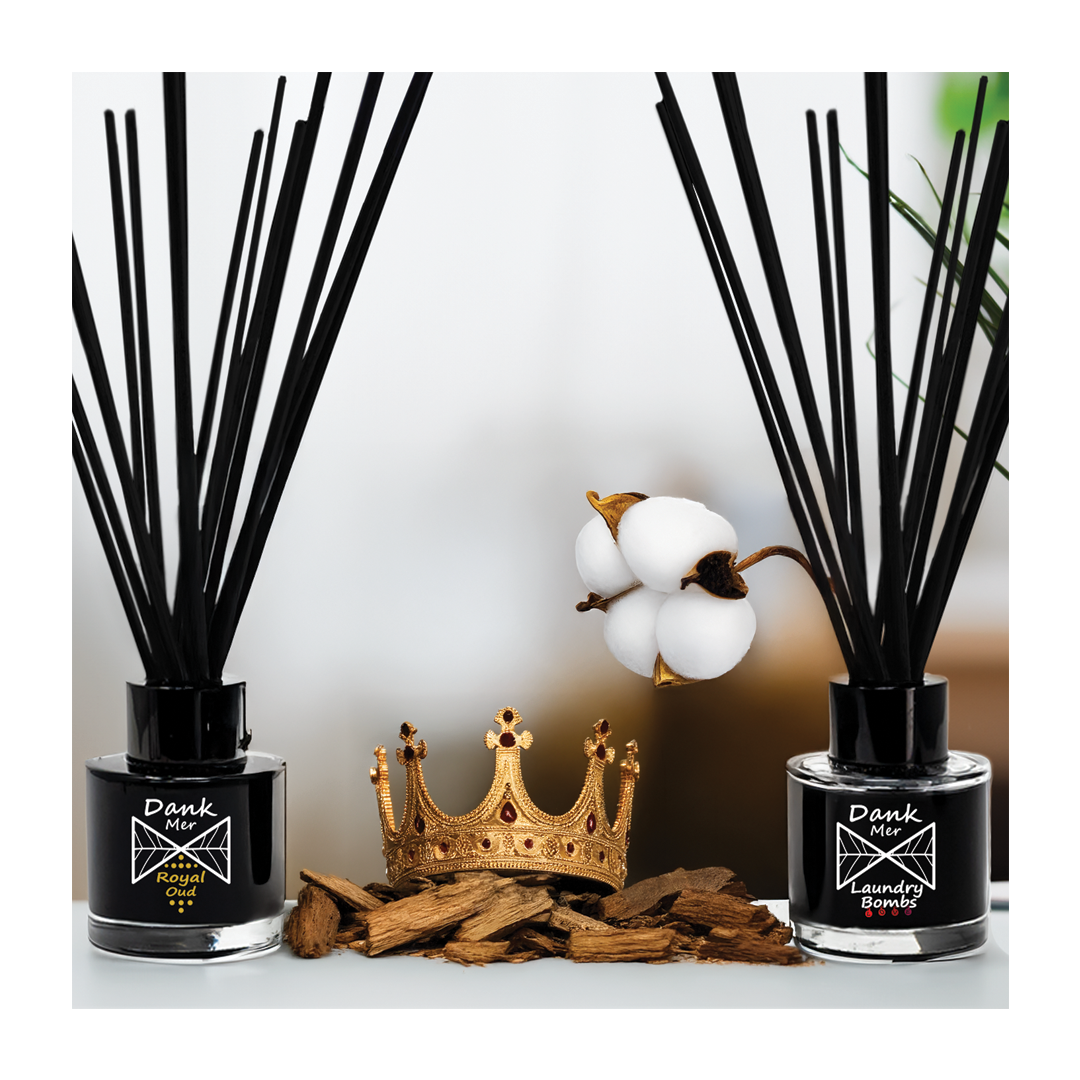 Vegan reed diffuser set with black bottles and natural elements, perfect gift for any occasion.
